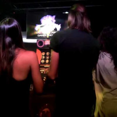 Party with Karaoke Machine with People Singing