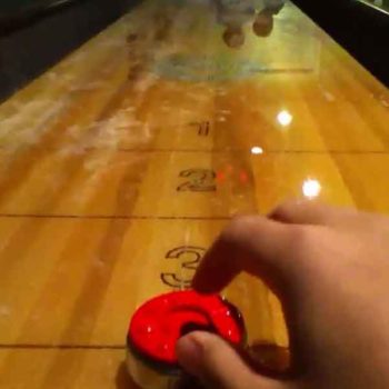 Playing shuffleboard red weight