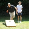 Tossing Bean Bag playing Cornhole Game