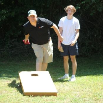 Tossing Bean Bag playing Cornhole Game