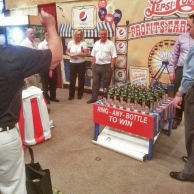 Tossing Rings at Ring Toss Game in Trade Show Booth