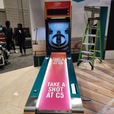 Custom Branded Skeeball Machine lane and header in tradeshow booth