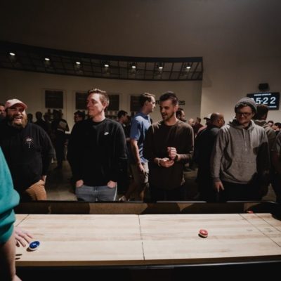 Playing 9ft Shuffleboard Tables at Church Event