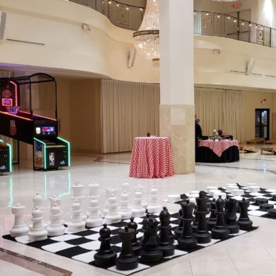 Setup of Giant Chess, Giant Checkers, Cornhole and LED NBA Hoops Basketball Arcade at Corp Event
